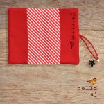 handmade journal cover open flat showing red and white striped interior lining – hello.aj