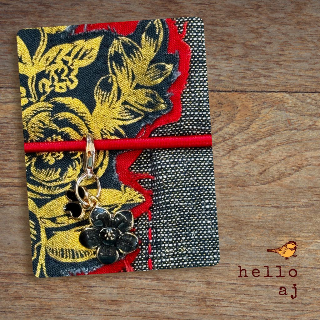 close-up detail gold floral raw edge applique on navy tweed handmade journal cover – hello.aj